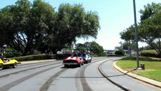 Tomorrowland Speedway ridethrough at Disneys Magic Kingdom theme park [upl. by Apfelstadt]